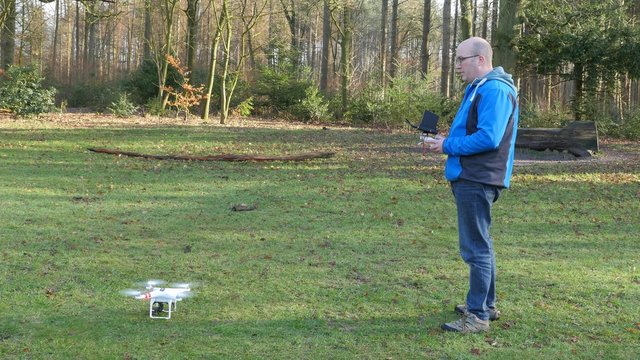 A man is operating a drone, 4K UltraHD, 4K UltraHD