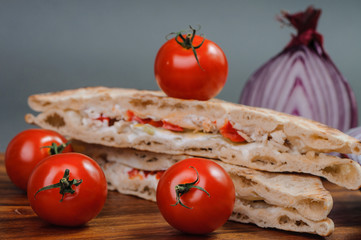 Tasty sandwich and fresh tomatoes.