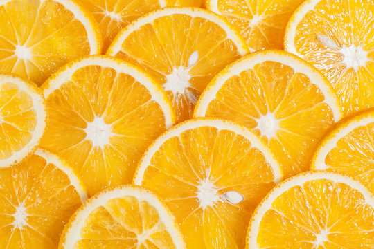 orange fruit in section in white water