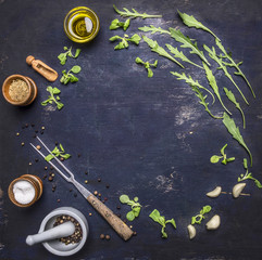 Healthy vegetarian foods, herbs and vegetables lined frame with spices place for text on wooden rustic background top view close up