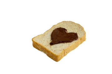 slice bread with heart shape of chocolate hazelnut spread side view, isolated on white background.