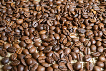 Roasted brown coffee beans, can be used as a background and texture