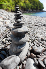 Fototapeta na wymiar Stack of stones on sea shore closeup, Hin ngam island, Lipe isla