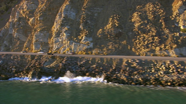 Man driving convertible, aerial shot