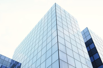 Fototapeta na wymiar Perspective and underside angle view of modern glass blue building skyscrapers. Blue sky, horizontal mockup. 3d render