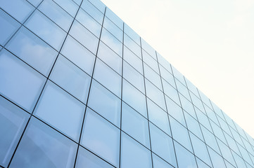 Perspective and underside angle view modern skyscraper business district in day light. Blue Skyscraper facade, office buildings. Horizontal mock up. 3d render