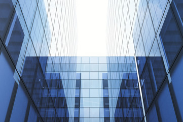 Perspective and underside angle view to textured background of modern glass blue building skyscrapers. Horizontal mockup. 3d render