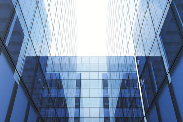 Obraz premium Perspective and underside angle view to textured background of modern glass blue building skyscrapers. Horizontal mockup. 3d render