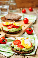 smashed avocado, tomatoes, egg sandwich