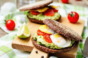 smashed avocado, tomatoes, egg sandwich