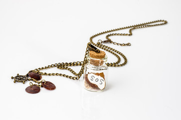 Pendant made with glass bottle, antique gold chain and amber iso