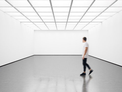 Photo of student in modern gallery looking at the empty canvas. Blank mockup, motion blur 