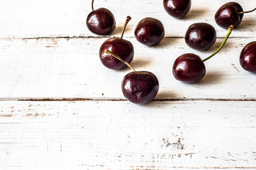 Cherries on wood background