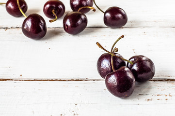 Cherries on wood background
