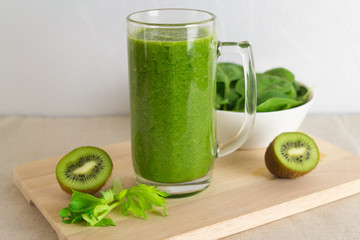 Healthy green smoothie made from spinach, celery and bananas