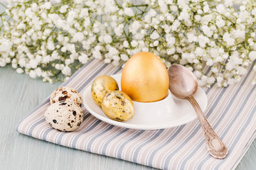 Easter breakfast. Colorful Easter eggs and flowers