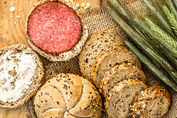 Sandwich with salami. Whole wheat rye bread rolls with ears of cereal