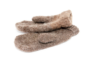 A pair of brown woolen gloves on a white background