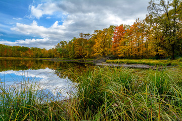 Fototapeta na wymiar Fall colors accentuate the shorline of a remote lake in northern Wisconsin.