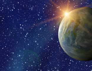 earth planet on sun and stars background with flare
