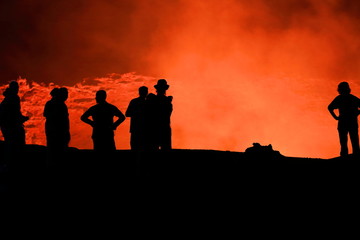Obraz na płótnie Canvas Tourist silhouettes-burning lava lake. Erta Ale volcano-Danakil-Ethiopia. 0227