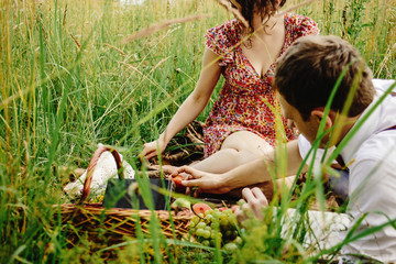 beautiful happy bride and stylish retro groom lying on tweed bla
