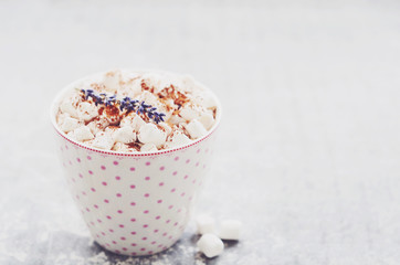 Coffee with marshmallow, lavender and cinnamon in pink spotted cup