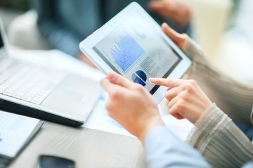 Image of business team sitting at the table and discussing 