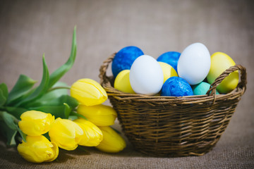 Obraz na płótnie Canvas Colorful Easter eggs on a brown background