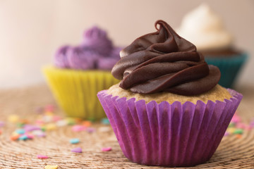 Delicious cupcakes with dark chocolate and buttercream frosting
