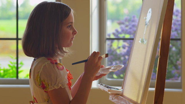 Young girl painting