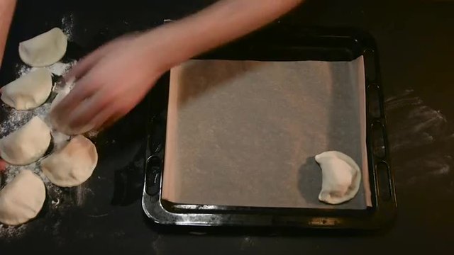 Chef Puts Patties on a Baking Tray For Baking