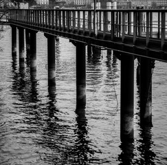 Fototapeta premium Pier column out of the water with shadows
