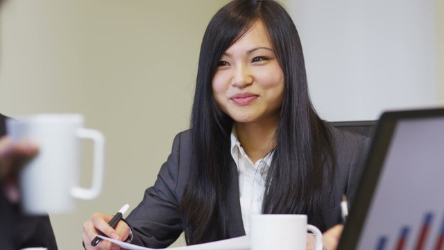 Young Asian businesswoman in meeting