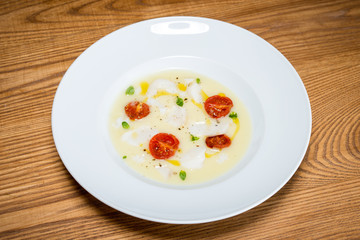 cod on mashed potatoes and tomato confit