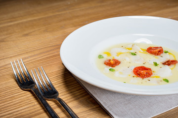 cod on mashed potatoes and tomato confit