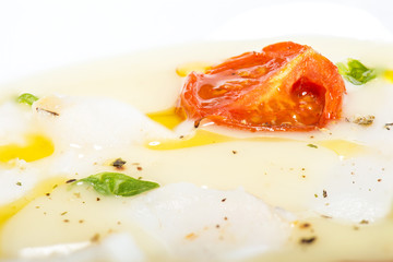 cod on mashed potatoes and tomato confit