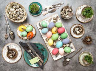Fototapeta na wymiar Easter decoration. Table place setting colored eggs