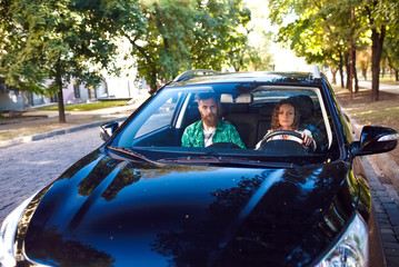 Fototapeta premium Happy couple in the car