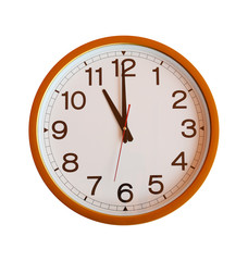 orange wall clock isolated in eleven o'clock.