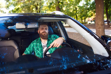 Bearded man in the car