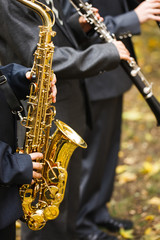 Naklejka premium group of musicians playing the saxophone.