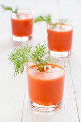 Carrot juice in three glasses