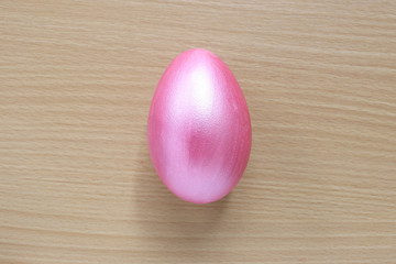 Pink of easter eggs on wood background.