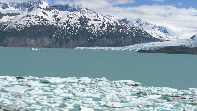 Flying over glacier and lake, Alaska