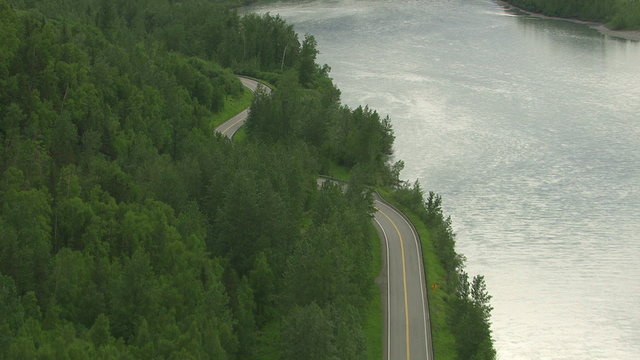 Aerial shot curvy road and forest, Alaska