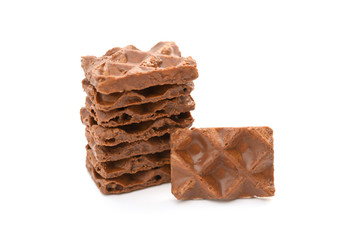 chocolate blocks stack up on a white background