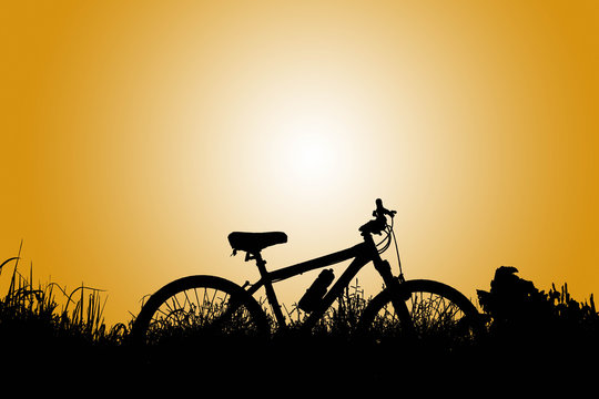 silhouette of bicycle at sunset