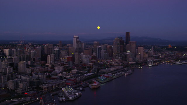 Aerial view of moon over Seattle Skyline