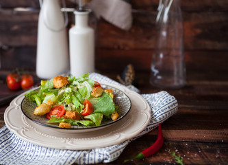 Caesar salad with croutons, quail eggs, cherry tomatoes and gril